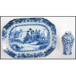 An 18th Century ceramic tray hand painted in a blue and white pattern with a landscape scene to
