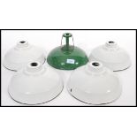A collection of vintage 20th Century industrial factory enamelled ceiling pendant light shades /