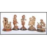 A selection of capodimonte style figurines to include a selection of street urchins having