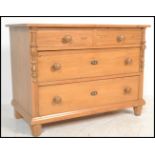 An antique style Scandinavian pine chest of drawers having 2 short and 2 deep drawers with flared