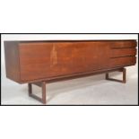 A White & Newton retro vintage teak wood sideboard credenza having a central cupboard flanked by a