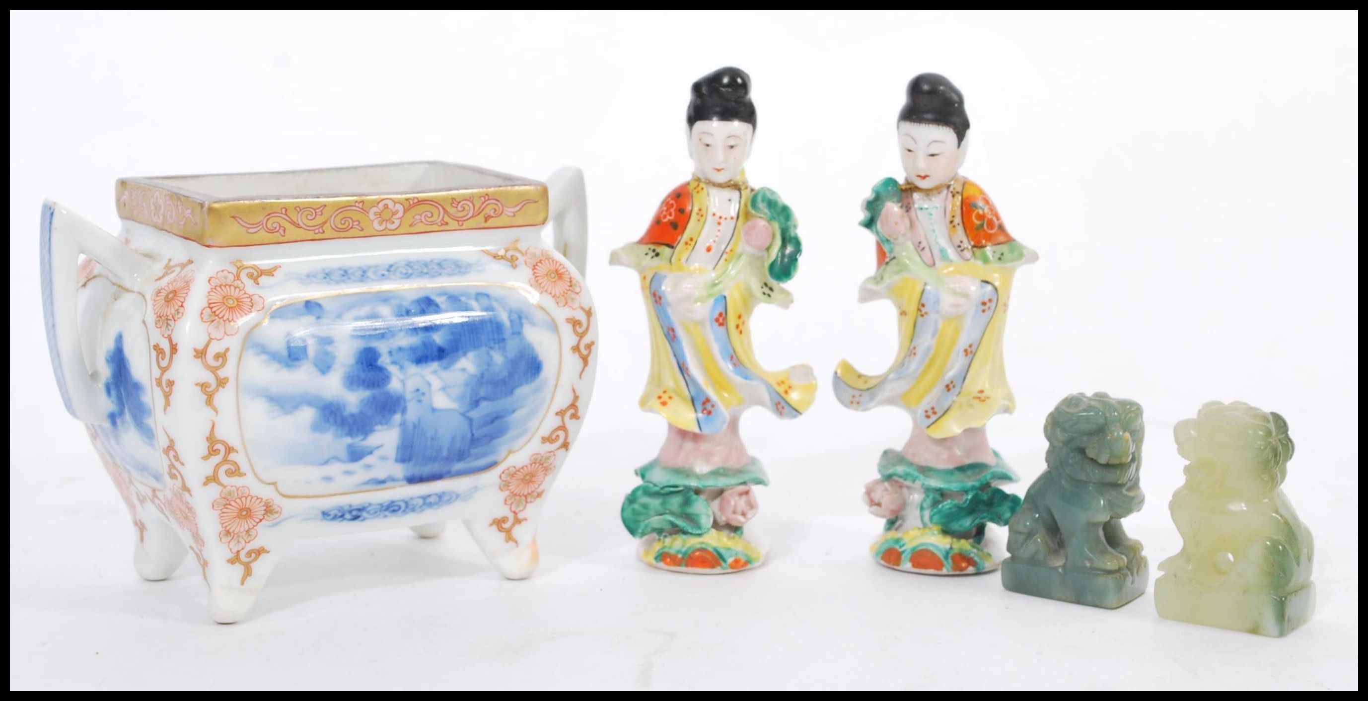 A selection of Chinese ceramics to include a pair of figurines depicting women in traditional dress,