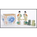 A selection of Chinese ceramics to include a pair of figurines depicting women in traditional dress,