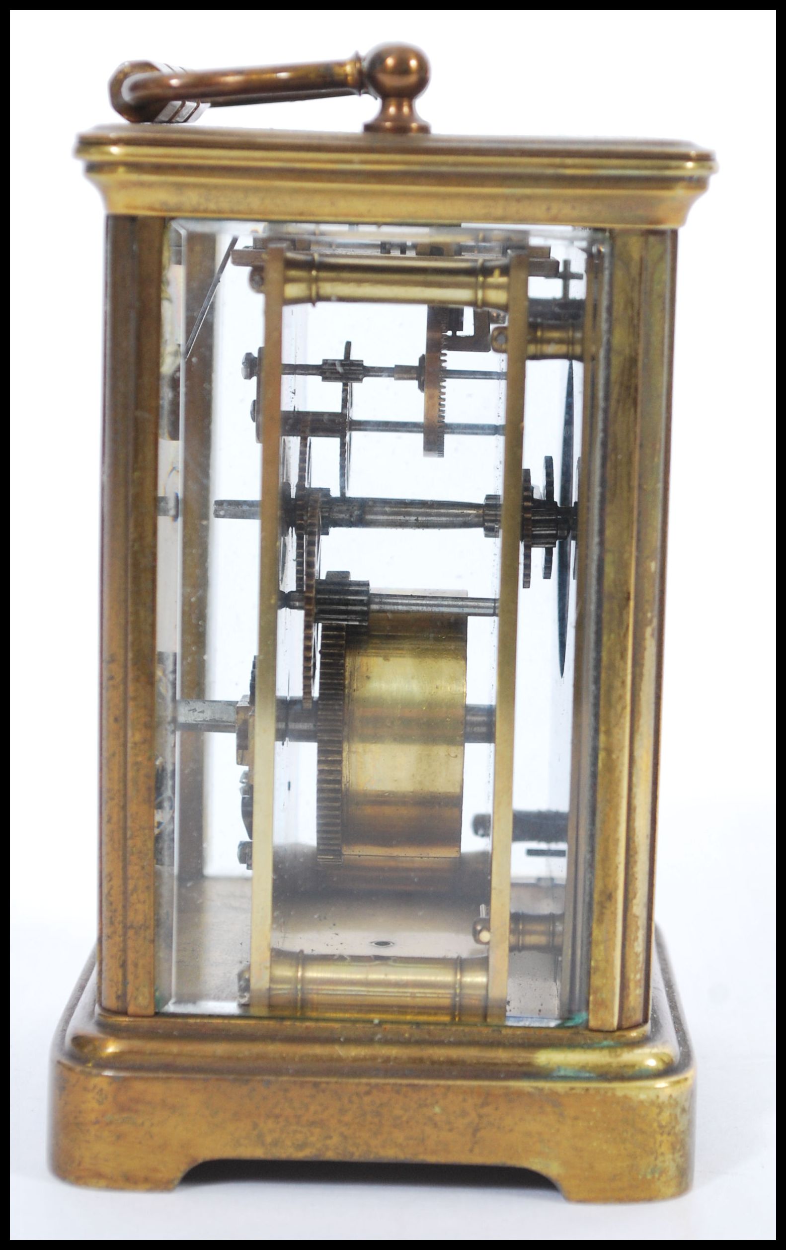 An early 20th Century brass bound carriage clock having roman numerals to the chapter ring and - Image 2 of 4
