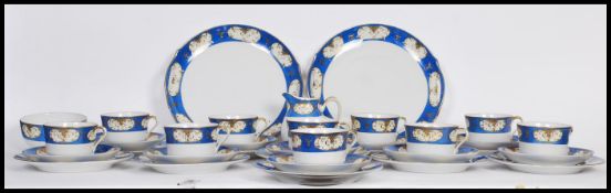 A vintage early 20th century Nippon hand painted tea service having cobalt and gilt decoration and