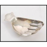A stunning silver hall marked caddy spoon in the form of a hand, Birmingham assay mark, dating to