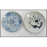 Two 18th century Chinese plates one having blue and white decoration and blue character mark to base