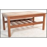 A retro 20th Century Danish inspired tile top teak wood coffee table together with a matching set of