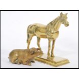 A vintage 20th century cast brass figurine of a horse raised on plinth base along with an unusual