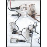 A group of six vintage retro 20th century cage / trouble inspection lamps having wire cages. Three