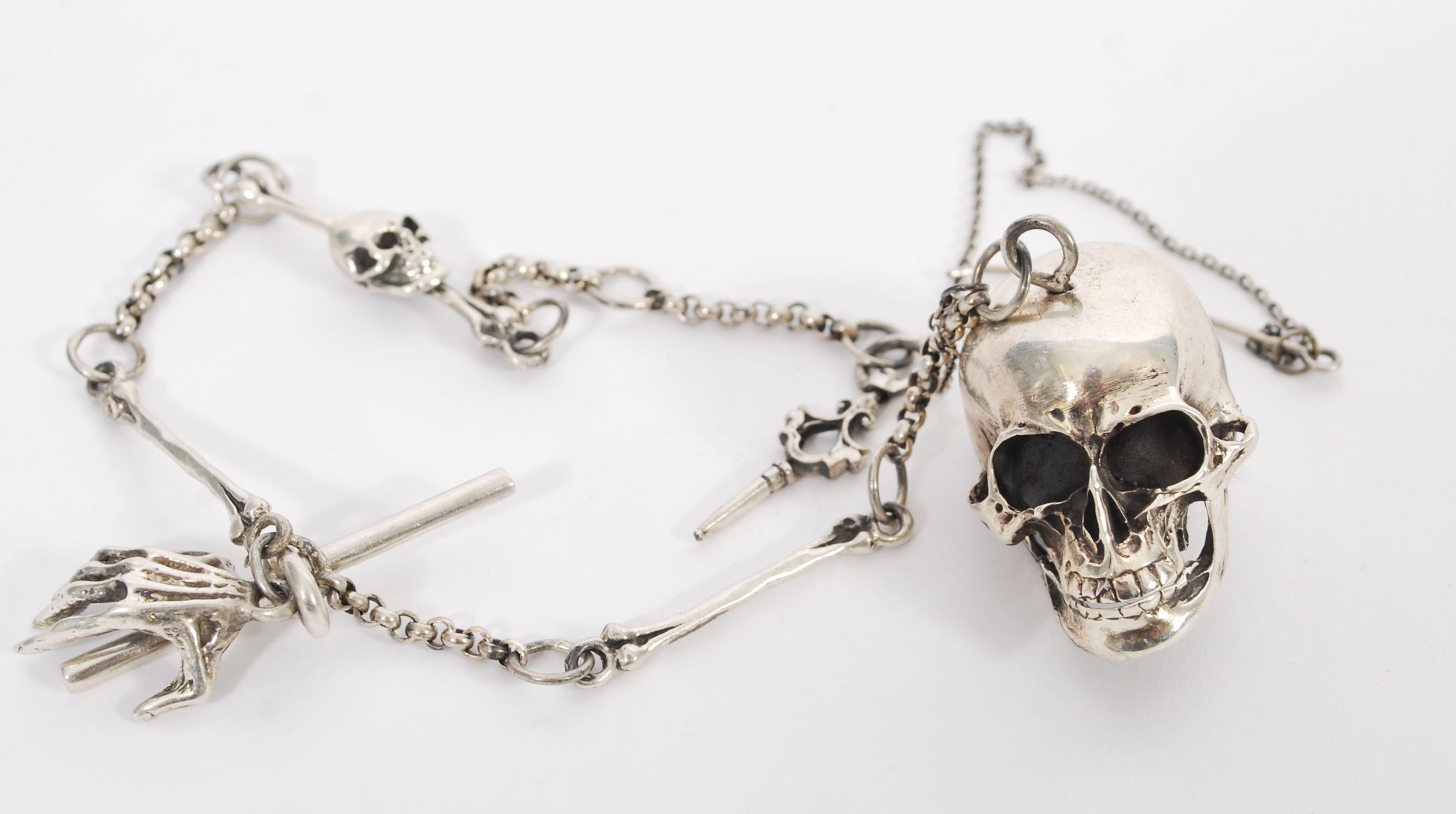 A gentleman's sterling silver albert watch chain having an articulated skull and and skeleton - Image 2 of 6