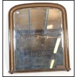 A Victorian 19th century large overmantel mirror having a giltwood large frame with arched top and