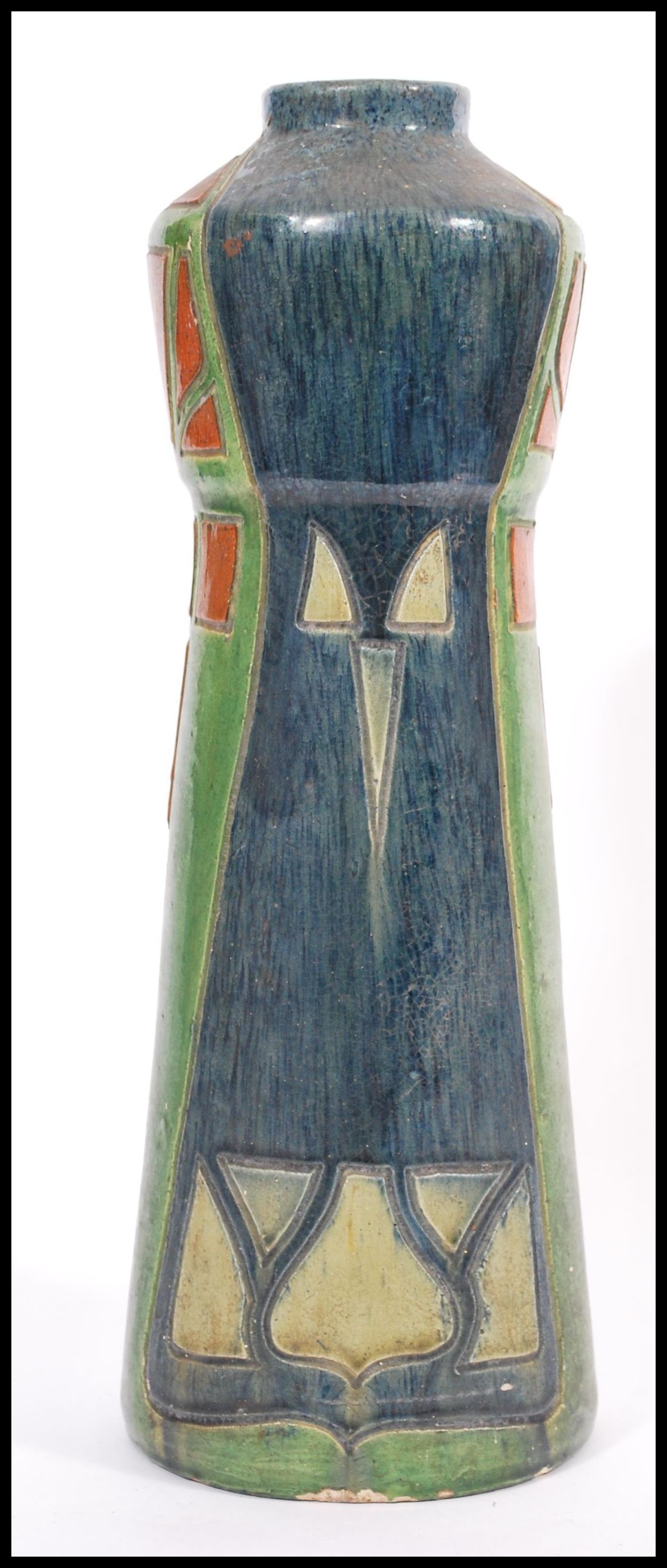 An early 20th century studio pottery vase in the Art Nouveau Secessionist  manner. Tapering body