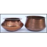 Two late 19th century / early 20th century Arts and Crafts large copper planters / bowls having
