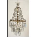 An early 20th century Edwardian gilt brass Empire chandelier of small proportions having multiple