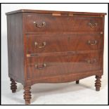 A 19th century flame mahogany Georgian chest of drawers raised on turned legs. The straight bank