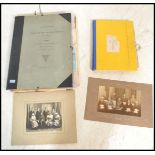 A collection of sundry watercolours prints and photographs held within two portfolio folders