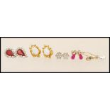 A selection of 9ct gold earrings to include a pair of stud earrings set with opals, a pair of stud