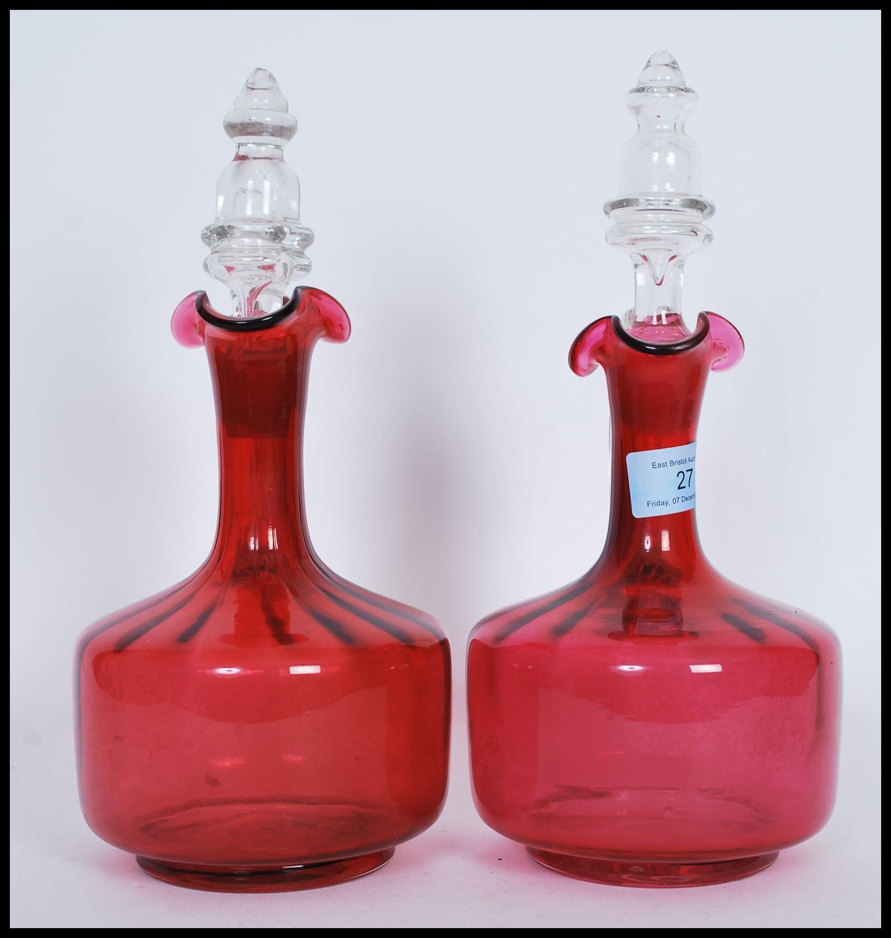 A pair of 19th Century Victorian cranberry glass decanters, both fitted with original cut glass - Image 4 of 5