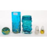 A selection of Mdina glassware to include a green and yellow swirl paperweight, two swirl