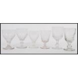 A harlequin set of six 18th/19th century wine / rummer glass glasses each raised on a circular