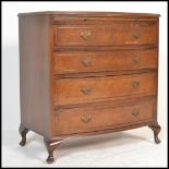 A vintage 20th Century mahogany Queen Anne revival bow fronted bachelors chest of drawers, having