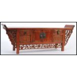 A vintage 20th century Chinese hardwood Pagoda top desk cabinet of alter shape with a