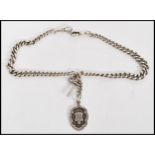 An early 20th century silver hallmarked albert chain having a T bar clasp with armorial pendant fob.