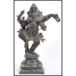 An early 20th century Indian bronze statue of the Hindu God Ganesha raised on square pedestal base