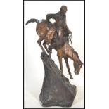 After Frederic Remington (1861-1909) " The Mountain Man ", a cast and patinated hollow cast bronze