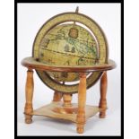 A vintage 20th century wooden desk top globe havin
