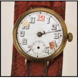 A vintage early 20th century WW1 officers trench watch set to an oversized leather strap. The