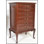 An early 20th Century Edwardian mahogany six drawer music cabinet, fall front drawers fitted with