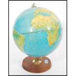 A vintage retro 20th century 1960's Philips desktop terrestrial globe raised on circular wooden base