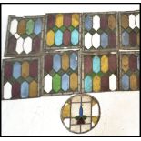 A collection of 19th Century Art Nouveau leaded stained glass window panels, nine in total, eight