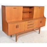 A 1970's G-Plan highboard sideboard in the Sienna pattern. Raised on tapering legs with a series