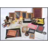 A collection of old photographic equipment in two boxes to include darkroom equipment, films,