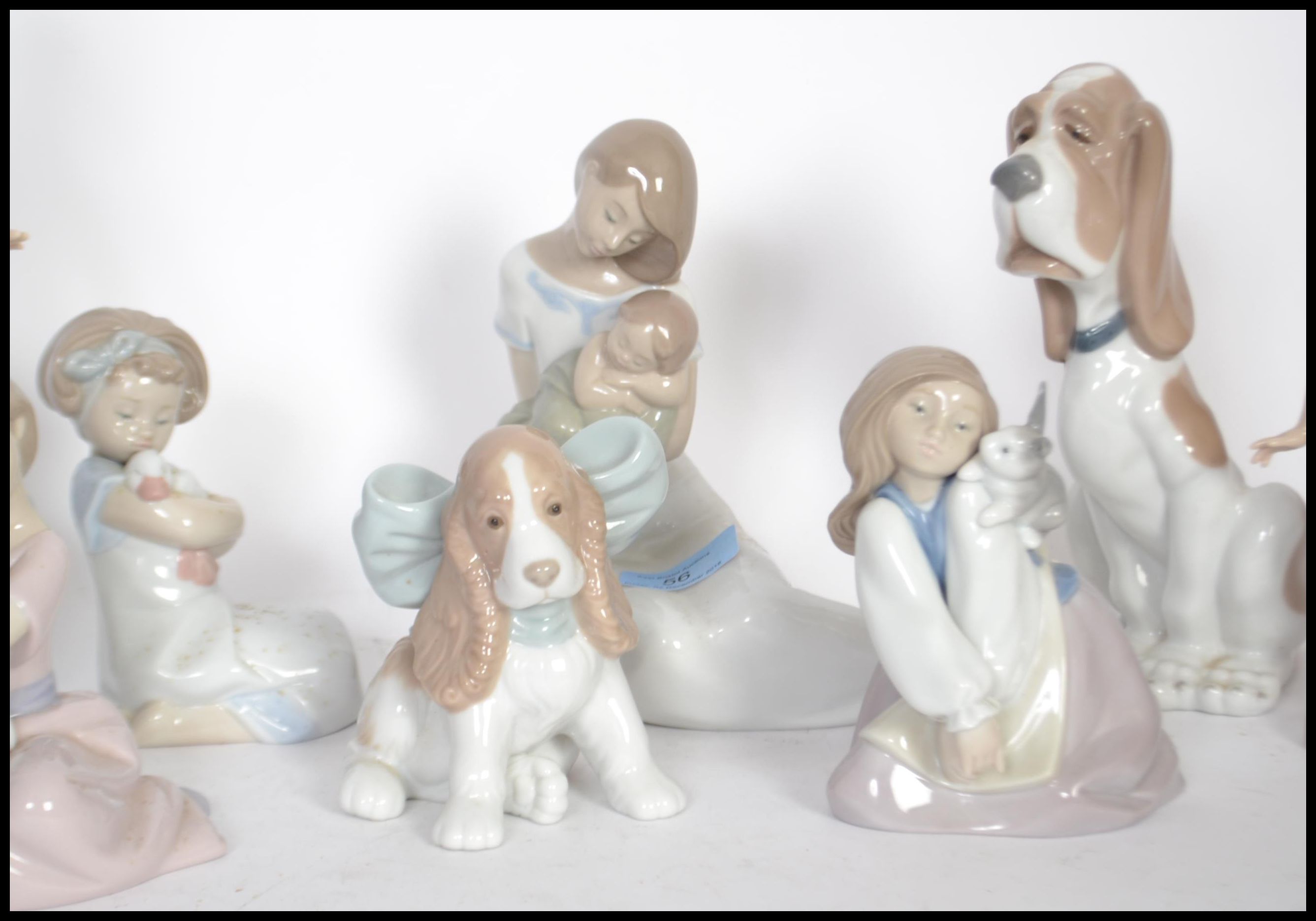 A collection of NAO ceramic figurines to include a mother and child figure, a girl holding a candle, - Image 3 of 5