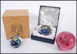 A limited edition paperweight control bubble no 22/500 possibly Caithness together with a large