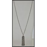 An early 20th Century Victorian silver pendant necklace with a cheroot holder case pendant with