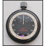 A vintage 20th century Omega stopwatch timer clock of pocket watch shape complete in original box.