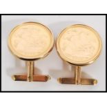 A pair of half sovereign gold coin cufflinks by the Royal Mint set to 9ct gold cuffs complete in