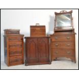 A 19th century Arts & Crafts oak dressing chest of drawers having good swing mirror over bank of
