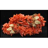 A vintage Frank Hess / Miriam Haskell spezzati coral coil bracelet having gold tone filigree and