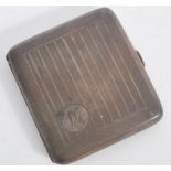 An early 20th century silver hallmarked cigarette case of square form with engine turned decoration.