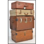 A stack of vintage 20th century to include 2 early tin tack trunks together with 2 vintage