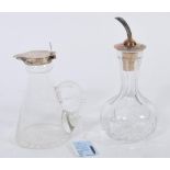 A silver hallmarked lidded glass toddy whisky miniature decanture along with a silver topped and