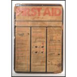 A vintage retro 20th century large First Aid board on card featuring 1970's instructions and
