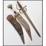 A 19th century Kukri knife in sheaf with bone decorated handle along with an antique dagger with