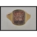 A hallmarked 9ct gold signet ring having a rectangular head with a turnable centre one side